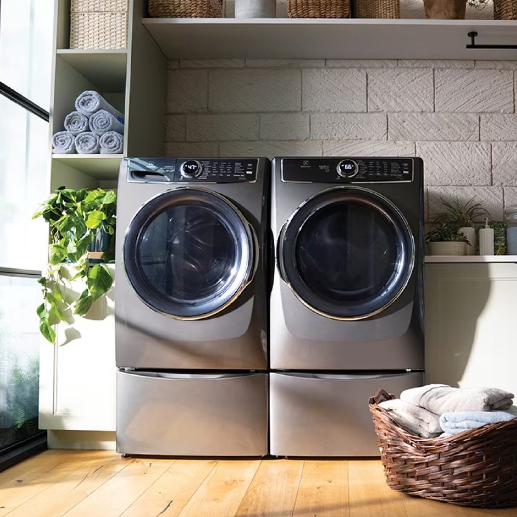 Titanium electric washer and dryers in a laundry room to highlight the color.
