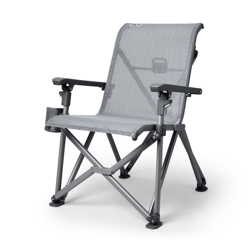 the YETI trailhead lawnchair sitting at an angle to show off its features. Including a cupholding on the left side of the chair's frame.