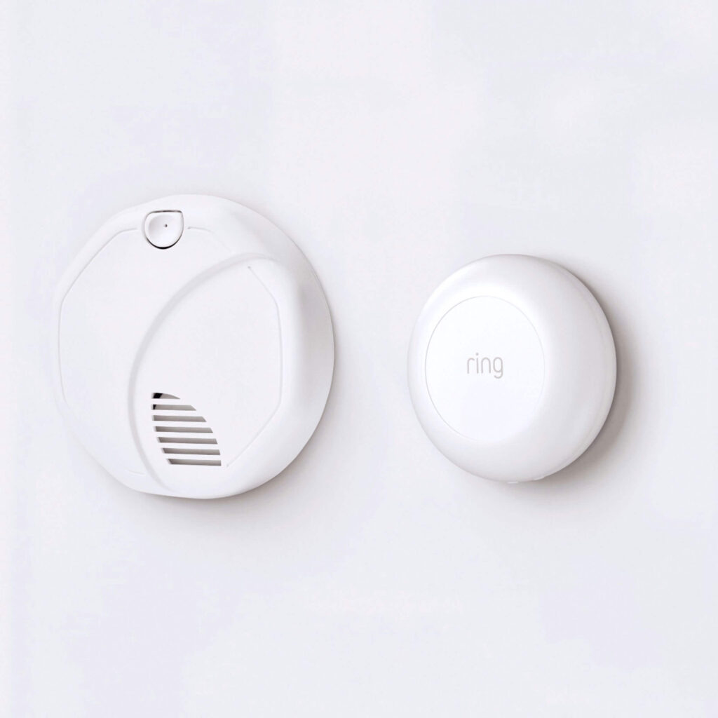 A ring smoke/CO alarm listening set up on a wall.