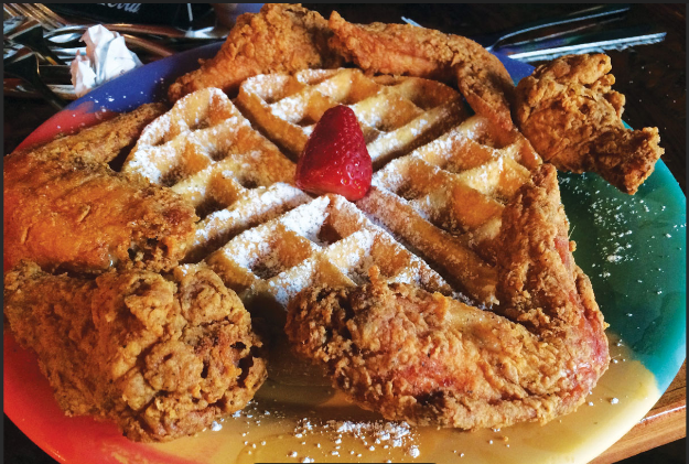 Fried chicken wings and a belgian waffle.