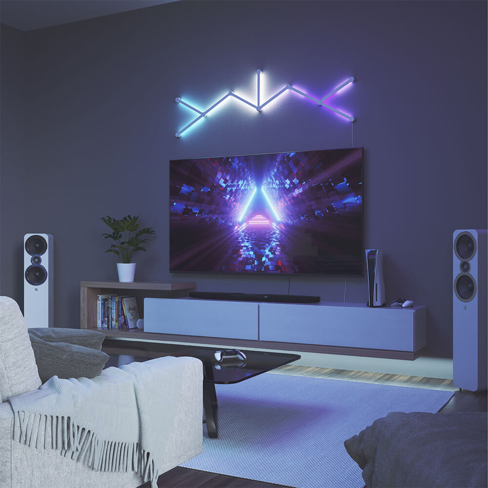 Cyan, white, and purple lights above a TV creating dynamic lighting.
